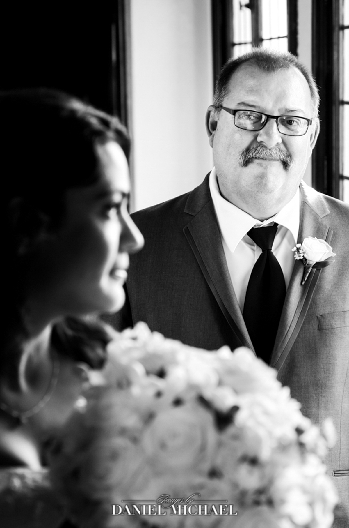 Father looking at Bride before walking down the aisle at her wedding